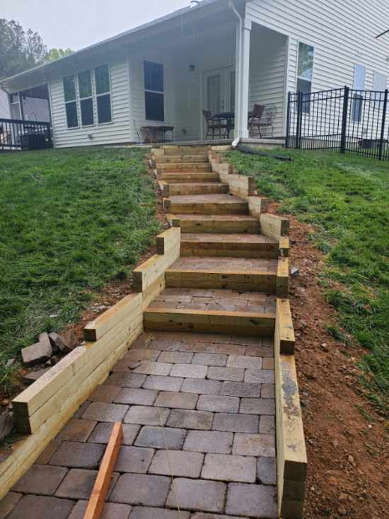 Custom landscape stairs and backyard grading construction project in North Carolina
